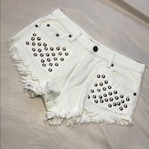 Studded distressed white jean shorts